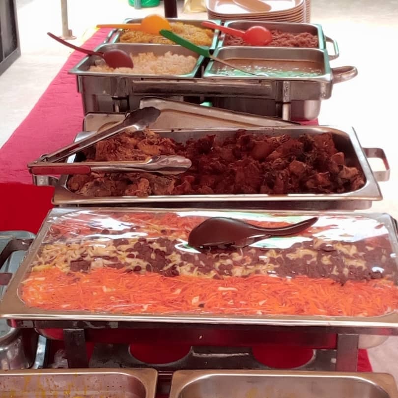 a display of diverse dishes at an event by mountain peak concept food project